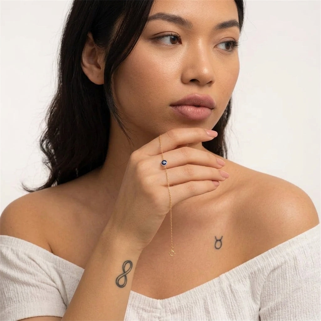 Minimalist evil eye bracelet worn on wrist