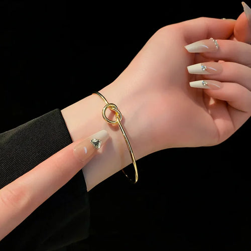 14K gold plated polished gold twisted bangle for women's fashion