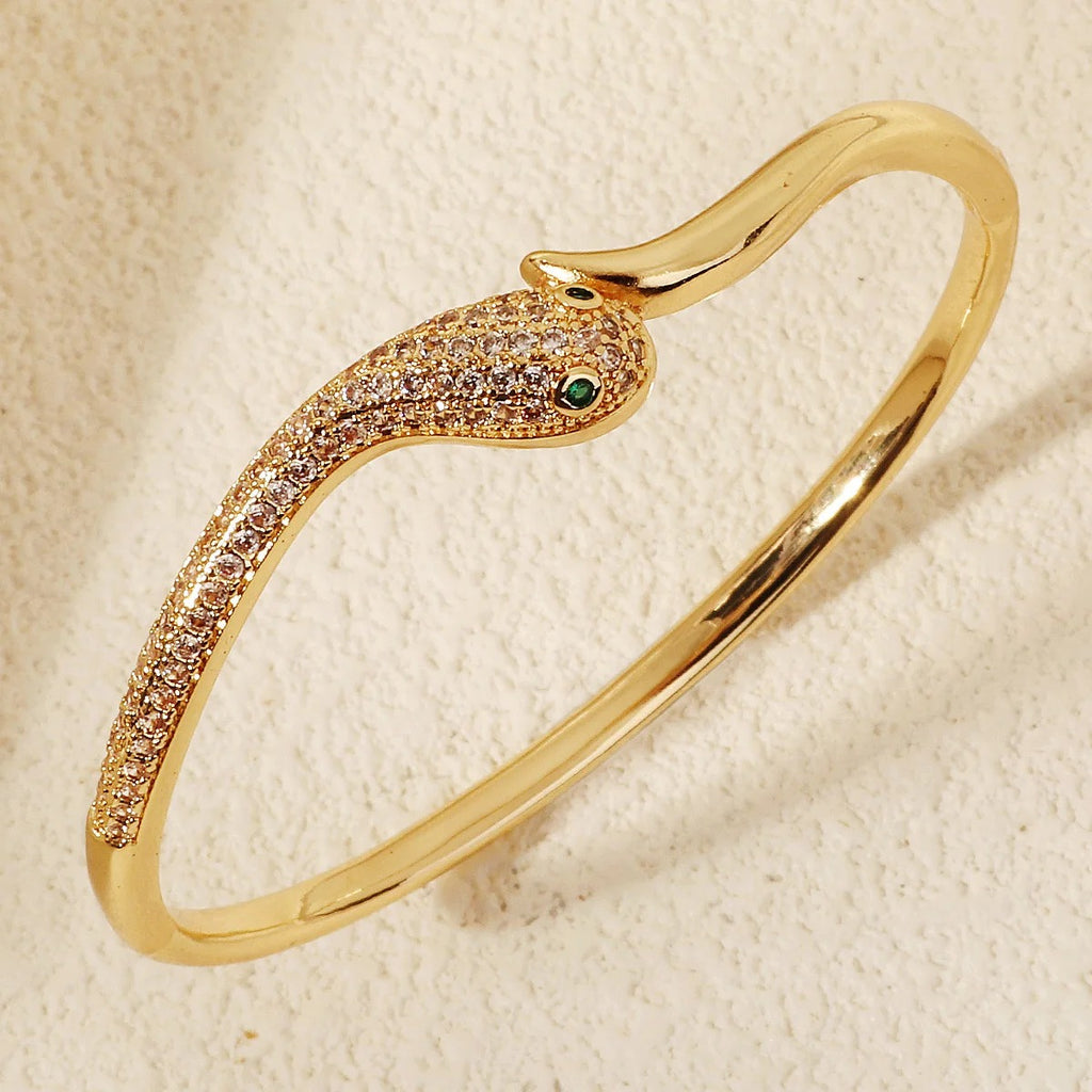 Gold Snake Wrap Bracelet with Cubic Zirconia crystals on white background