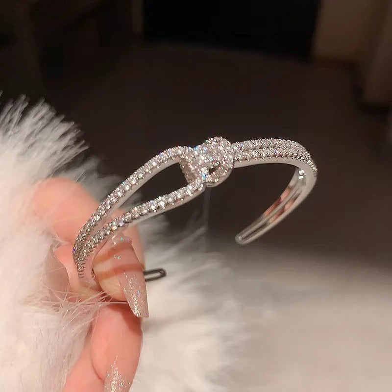 Close-up of the central knot detail on a premium gold-plated bracelet