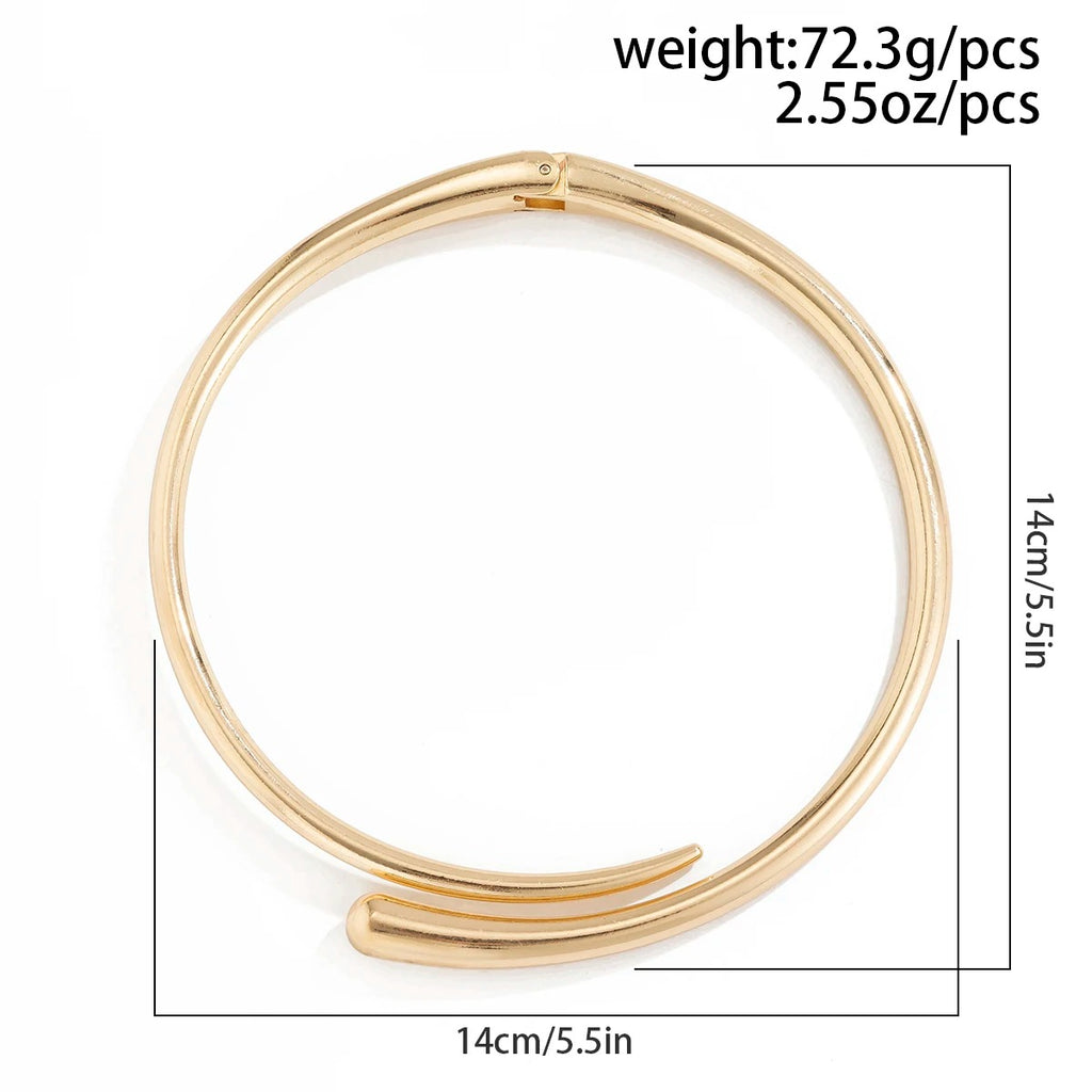 Gold bangle with measurements and weight information on a white background