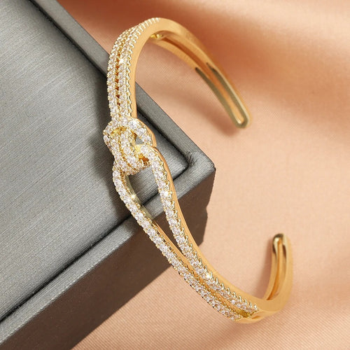 Gold Knot Cuff Bracelet for women in a minimalist open bangle design