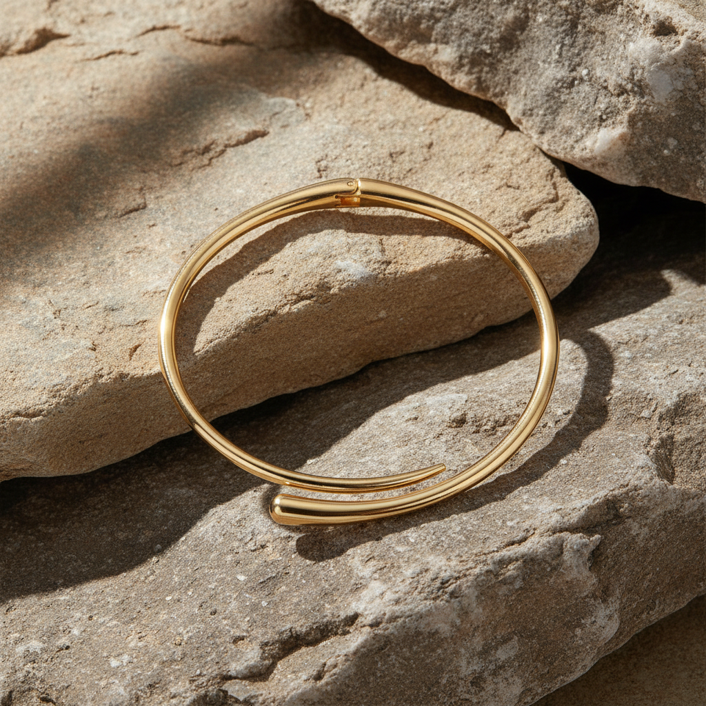 Sleek gold cuff bangle from the Velmeera women's jewelry collection