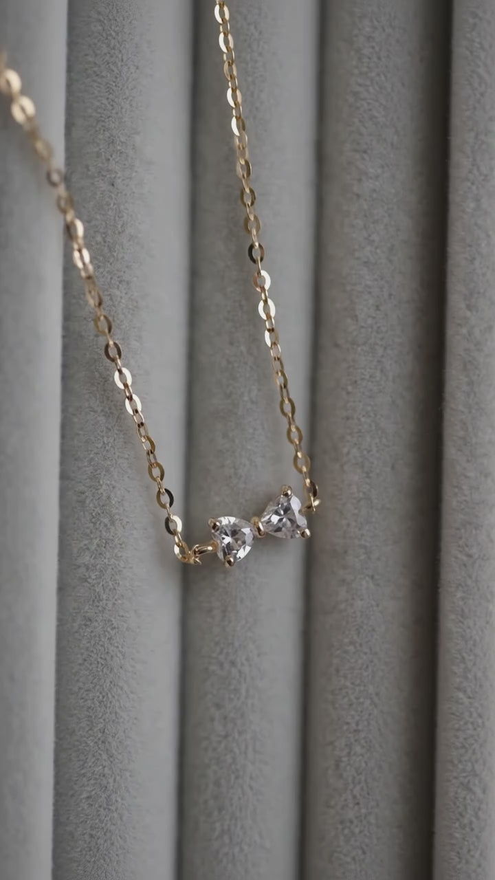 Gold bow bracelet with sparkling zircon details